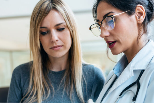 Doctor with patient looking at a tablet